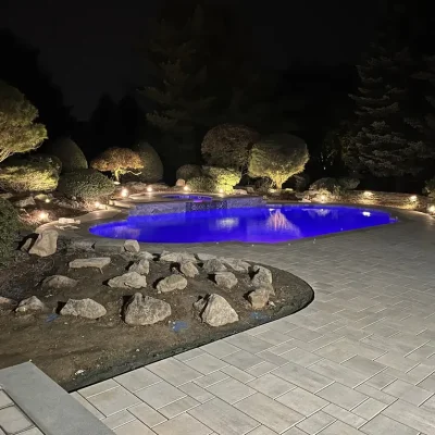 freeform-pool-lit-at-night