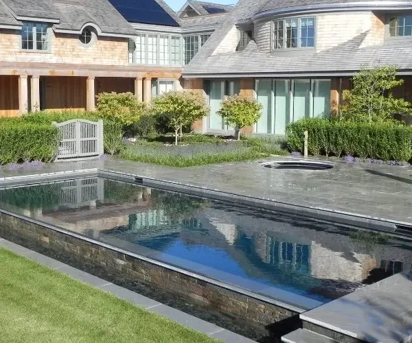 inground pool design with integrated spa